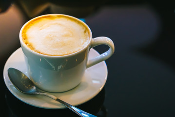 drinking hot coffee cappuccino in coffee shop 