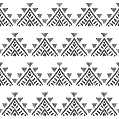 Modèle sans couture ethnique pour la décoration intérieure moderne. Conception graphique tribale. Forme géométrique texturée dans une palette noire et blanche épurée.
