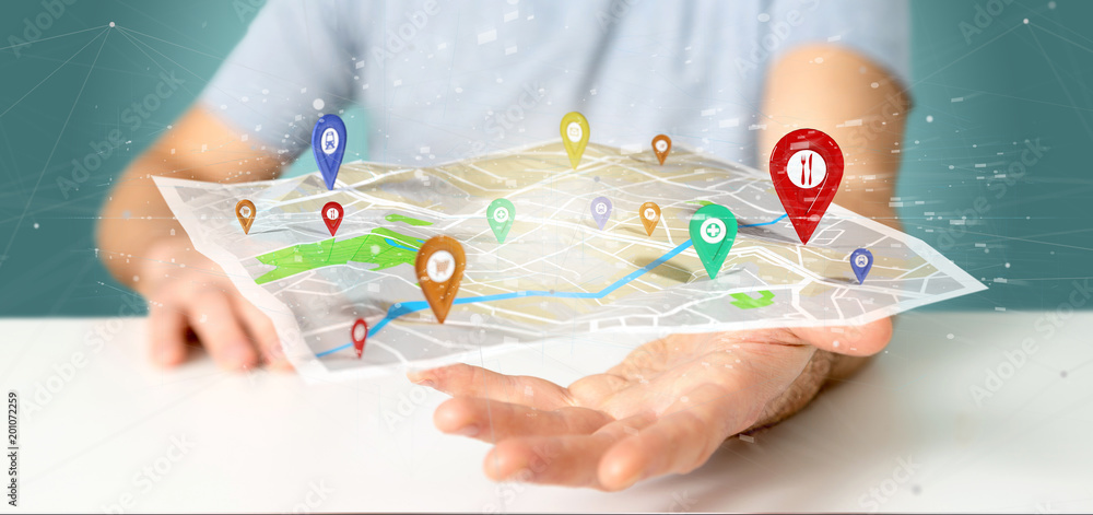 Poster man holding a 3d rendering pin holder on a map