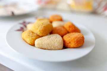 different baked cheese varieties lie on a plate