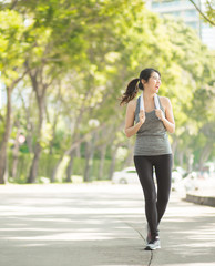 Fototapeta premium Beautiful Sport woman in sportswear running in the park. Healthy lifestyle and sport concept.