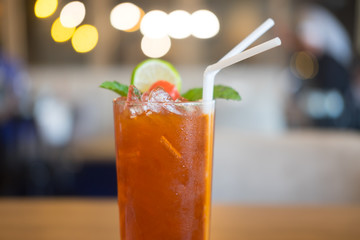 Iced tea with lime and ice cubes