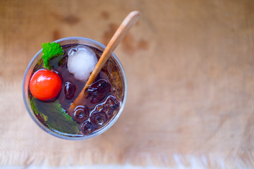 Fototapeta premium Cold drink with mint and ice in a glass