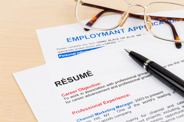 Resume and employment application form with glasses