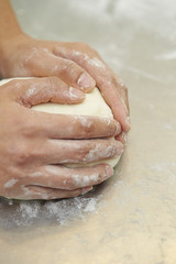 Fototapeta premium Kneading bread dough 