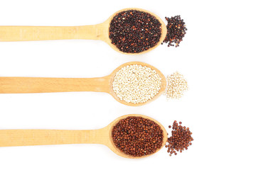 Black red white quinoa and chia seeds in wooden spoon isolated on white background with copy space for your text