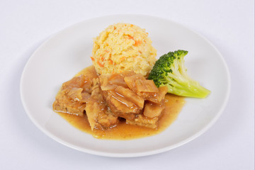 Tempeh on leek with pear purée on a white