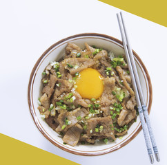 Japan style teriyaki pork with rice and egg in bolw on white background