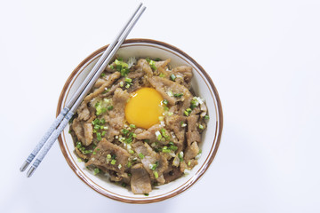 Japan style teriyaki pork with rice and egg in bolw on white background