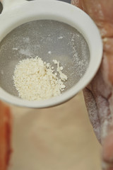 Shifting flour with sieve 