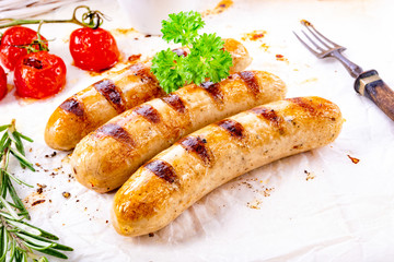 delicious bratwurst with ketchup and fresh rolls