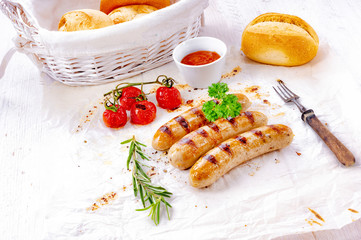 delicious bratwurst with ketchup and fresh rolls