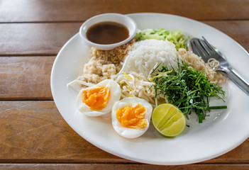  sweet and sour with rice, vegetable ,herbs and egg salad Thai southern style /Nasi Kerabu (Kao Yum)