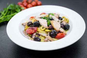 Spaghetti with Mediterranean tuna, capers, olives, Sicilian chilli pepper, cherry tomatoes and a sprinkling of parsley