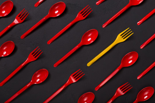 Top view on plastic forks on violet background