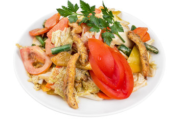 Nutritious salad vegetables and meats with tomato and chicken slices, served on a white plate. Isolated.