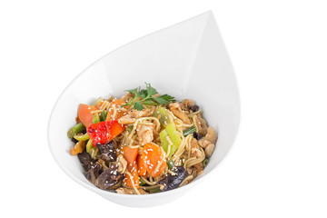 Egg noodles with meat and vegetables and mushrooms with teriyaki sauce isolated on white background. Egg noodles in a white plate.