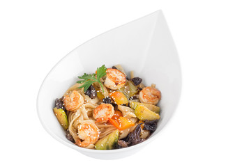 Wheat noodles with seafood, mushrooms and vegetables under teriyaki sauce isolated on white background. Wheat noodles in a white plate.