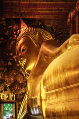 Golden reclining Buddha statue at the Wat Pho Temple, Bangkok, Thailand