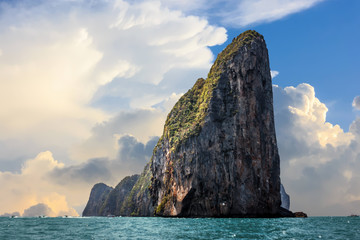 The cliff of Phi Phi leh with big clouds over a blue sky, Phi Phi island, Thailand
