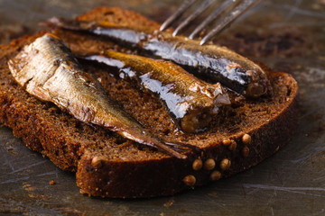 Under salt anchovies with slice of bread