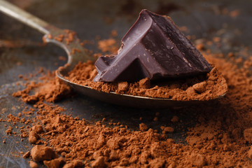 close up of chocolate pieces on wooden background