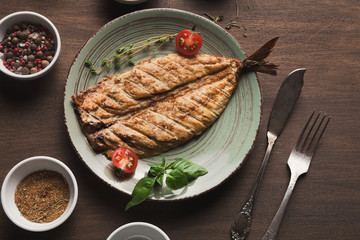 White fish juicy fillet grilled on barbecue