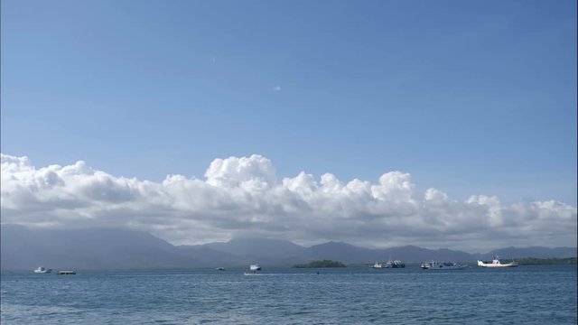 Baywalk vieuw over port with boats of Puerto Princesa, time lapse