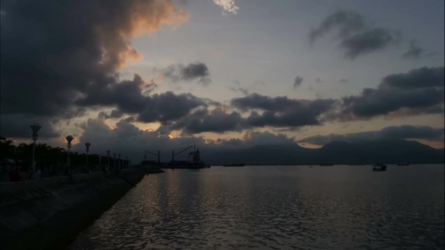 Baywalk vieuw over port with boats of Puerto Princesa, time lapse