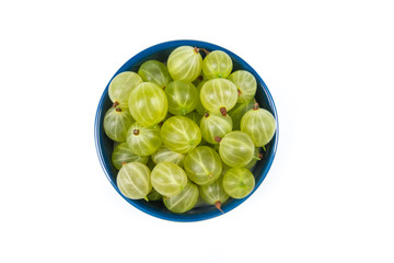 Fresh gooseberries on plate on Isolated white background. Berries