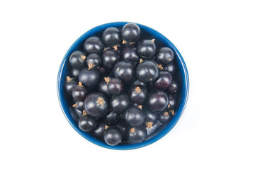 Fresh currant on plate on Isolated white background. Berries