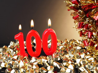 Birthday-anniversary candle showing Nr. 100

Lit red candle good for an anniversary or birthday...