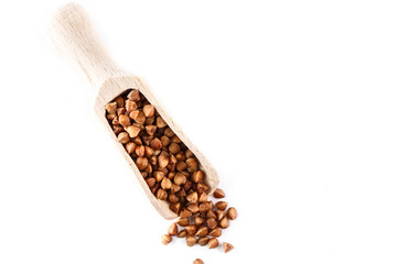 buckwheat in wooden scoop on white background. Isolate