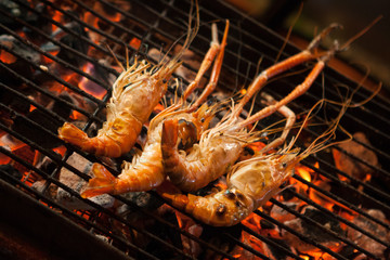 Grilled prawns sold at a street food market stall. Chinatown, Bangkok, Thailand