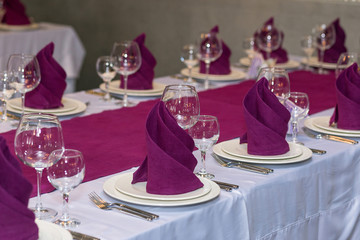 Empty glasses set for champagne and  wine in restaurant. Table setting for celebration