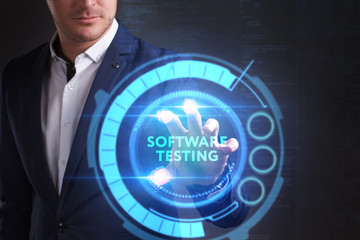 Business, Technology, Internet and network concept. Young businessman working on a virtual screen of the future and sees the inscription: Software testing