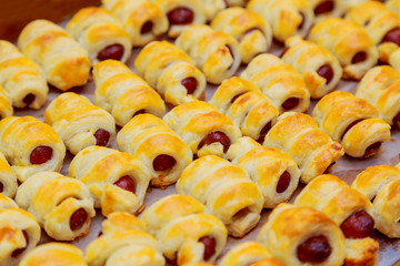 sausages in the dough Hot dog rolled in puff pastry