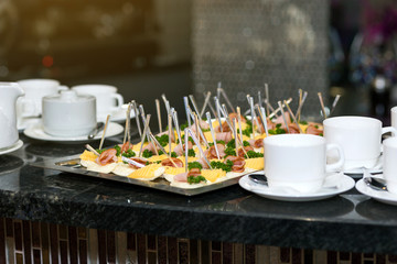 holiday buffet table served by different canape, sandwiches, snacks ready for eating in restaurant