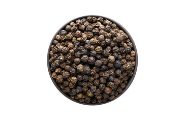 Black pepper grains in clay bowl isolated on white background. Seasoning or spice top view