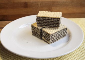 Waffles are on a white plate, dessert, close-up