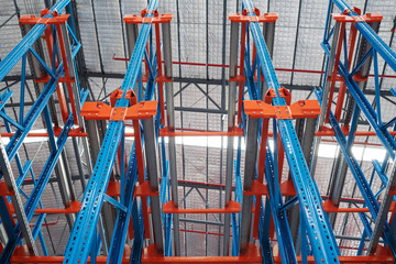 Warehouse storage interior with colorful steel shelves, pallet rack System