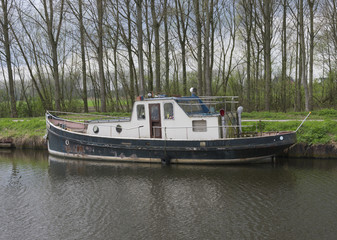 Fototapeta na wymiar Old boat with many rust spots along the side