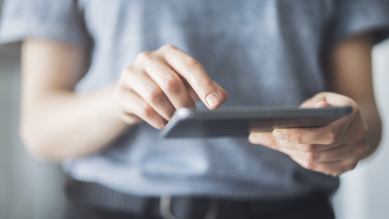 Woman using digital tablet close up view