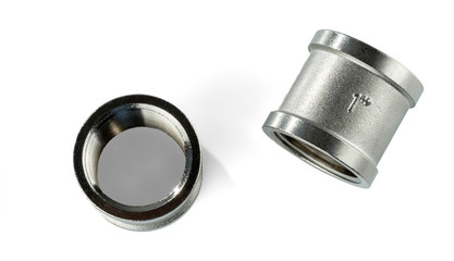 Two regular couplings of white metal with internal thread 1 inch. Isolated on white background..