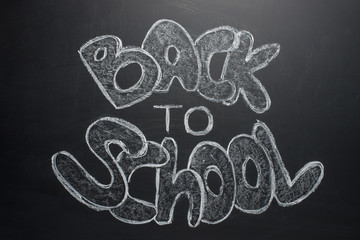 Back to school, the inscription with white chalk on a black school board