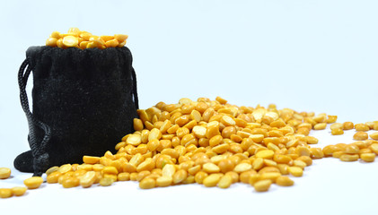 Full of Arhar or masoor Dhal or Toor Dal Pigeon Pea in bag and some tool dal on floor