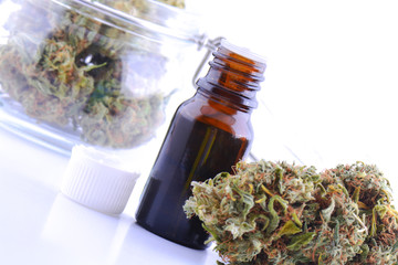 Medicinal marijuana cannabis with extract oil in a bottle. cannabis CBD oil hemp products. Cannabis oil extracts in jar