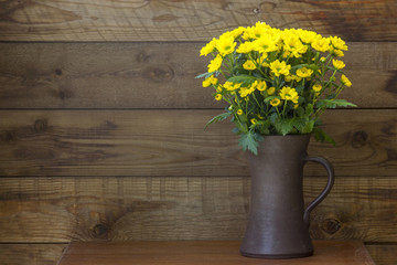 Beautiful yellow chrysanthemum flowers in a vase