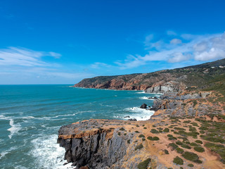 Aerial view from the Portuguese coastline with the ocean and the sintra mountains in background....