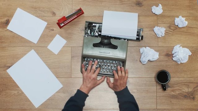 Book author's frustration, angry writer on a vintage typewriter. 4k video black and white and colors